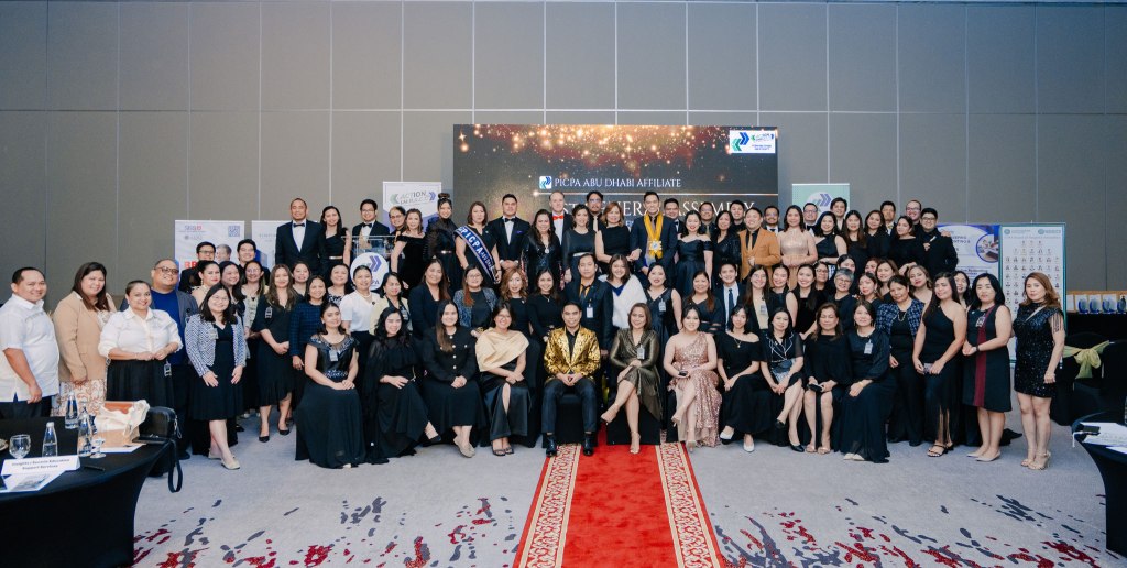 PICPA Abu Dhabi members gathered on stage at an affiliate celebration